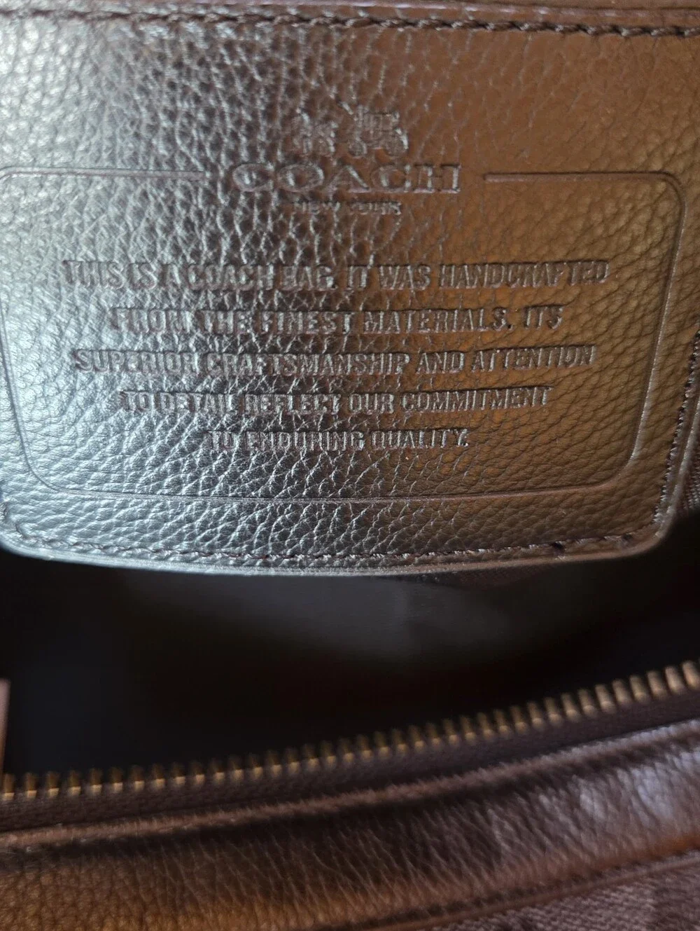 Coach Black Signature Leather Weekender tote bag dark gray and black.